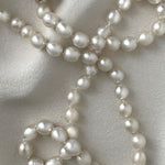 long South Sea pearl strand necklace with silver white oval pearls and sterling silver clasp