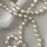 long South Sea pearl strand necklace with silver white oval pearls and sterling silver clasp