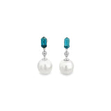 18ct white gold drop earrings featuring South Sea pearls, hexagonal-cut blue zircons, and round brilliant cut diamonds in articulated bezel settings.