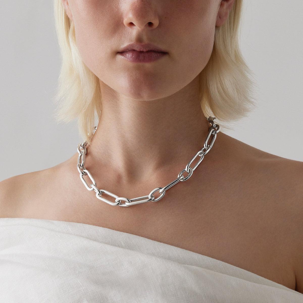 Sterling silver necklet with alternating oval links and T-bar clasp.