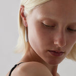 Sterling silver baton-shaped dewdrop drop earrings with fixed hooks.