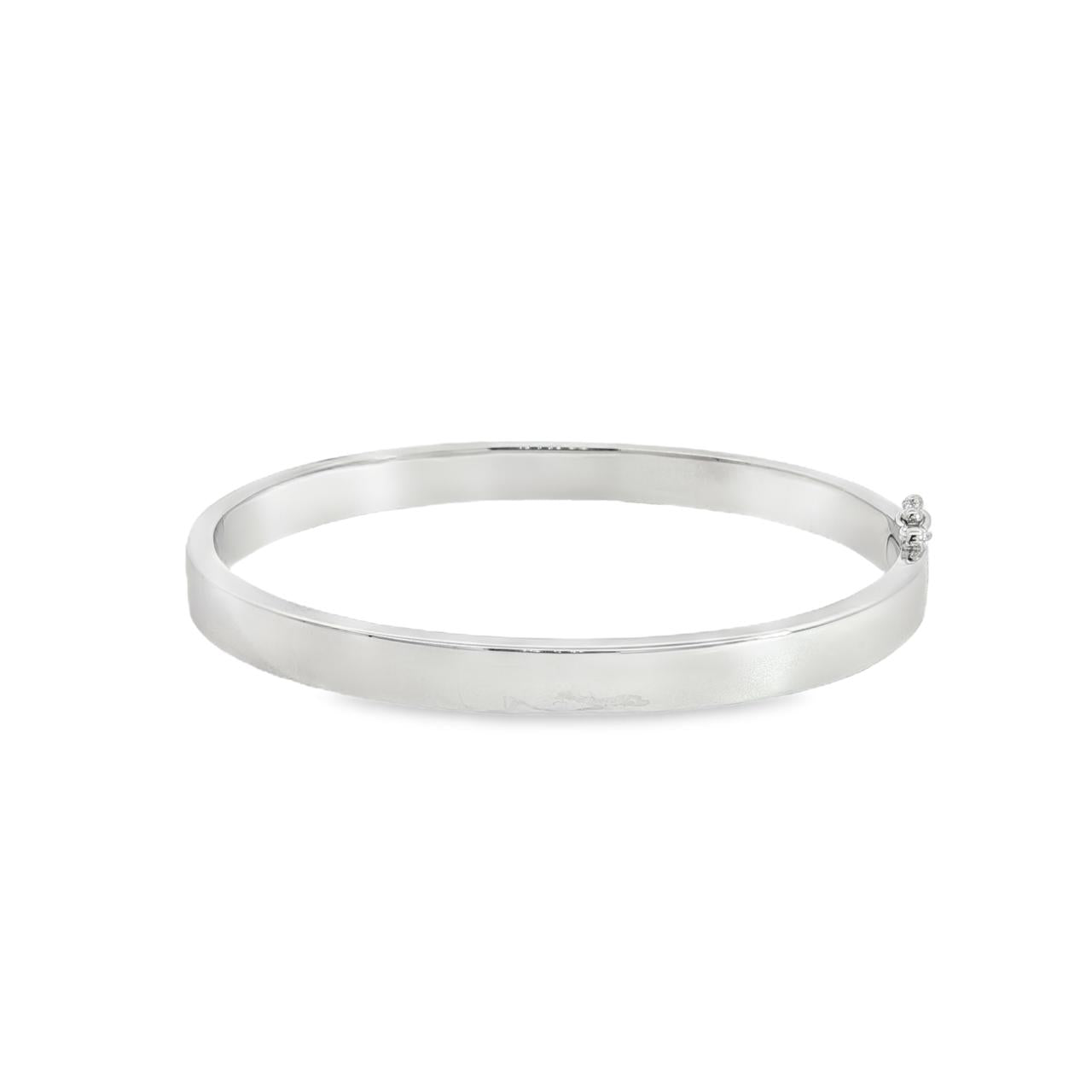 Sterling silver oval hinged bangle with slightly rounded flat profile.