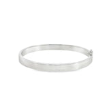 Sterling silver oval hinged bangle with slightly rounded flat profile.