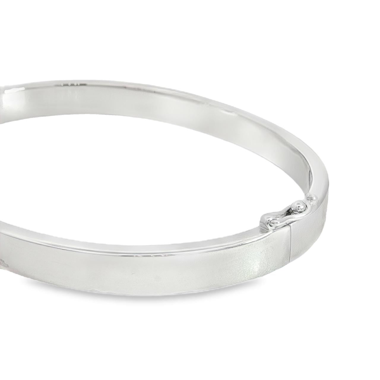 Sterling silver oval hinged bangle with slightly rounded flat profile.
