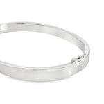Sterling silver oval hinged bangle with slightly rounded flat profile.