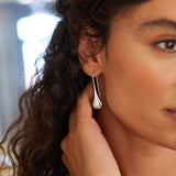 Sterling silver graduated puff raindrop hook earrings with polished finish