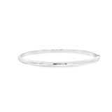 Sterling silver oval hinged bangle with high domed rounded profile.
