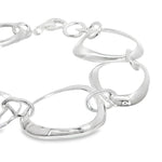 Sterling silver bracelet with open ovoid-shaped curved freeform links and lobster clasp, polished sculptural design.