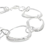 Sterling silver bracelet with open ovoid-shaped curved freeform links and lobster clasp, polished sculptural design.