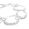 Sterling silver bracelet with open ovoid-shaped curved freeform links and lobster clasp, polished sculptural design.