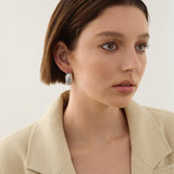 Sterling silver puff quilted hoop earrings with scalloped edge detailing.