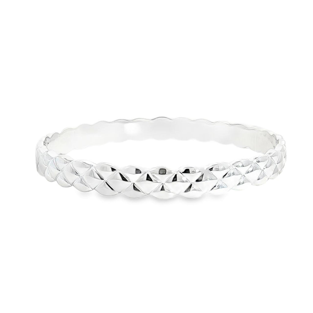 Sterling silver solid bangle featuring a puff quilted pattern with scalloped edges, polished finish, 8mm wide, 66mm internal diameter.