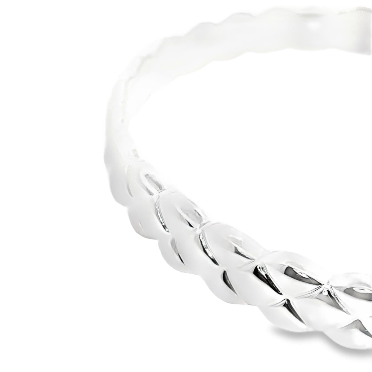 Sterling silver solid bangle featuring a puff quilted pattern with scalloped edges, polished finish, 8mm wide, 66mm internal diameter.