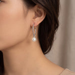 Sterling silver twist hoop earrings with removable 9mm South Sea pearl drops.