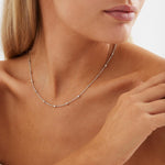 Sterling silver station necklet with textured cube details on a fine trace chain.