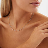 Sterling silver station necklet with textured cube details on a fine trace chain.