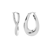 Sterling silver wavy graduated oval hoop earrings with sculptural polished finish.