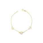 Yellow gold trace link bracelet with three mother of pearl butterfly motifs.