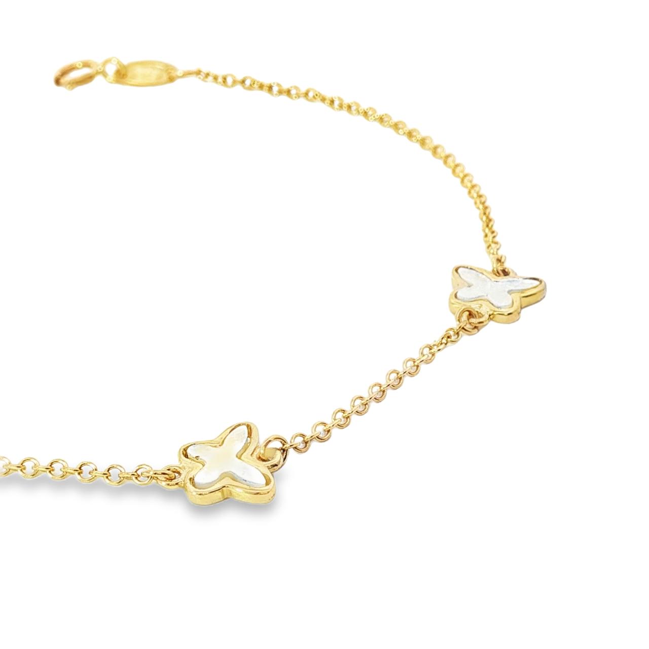 Yellow gold trace link bracelet with three mother of pearl butterfly motifs.