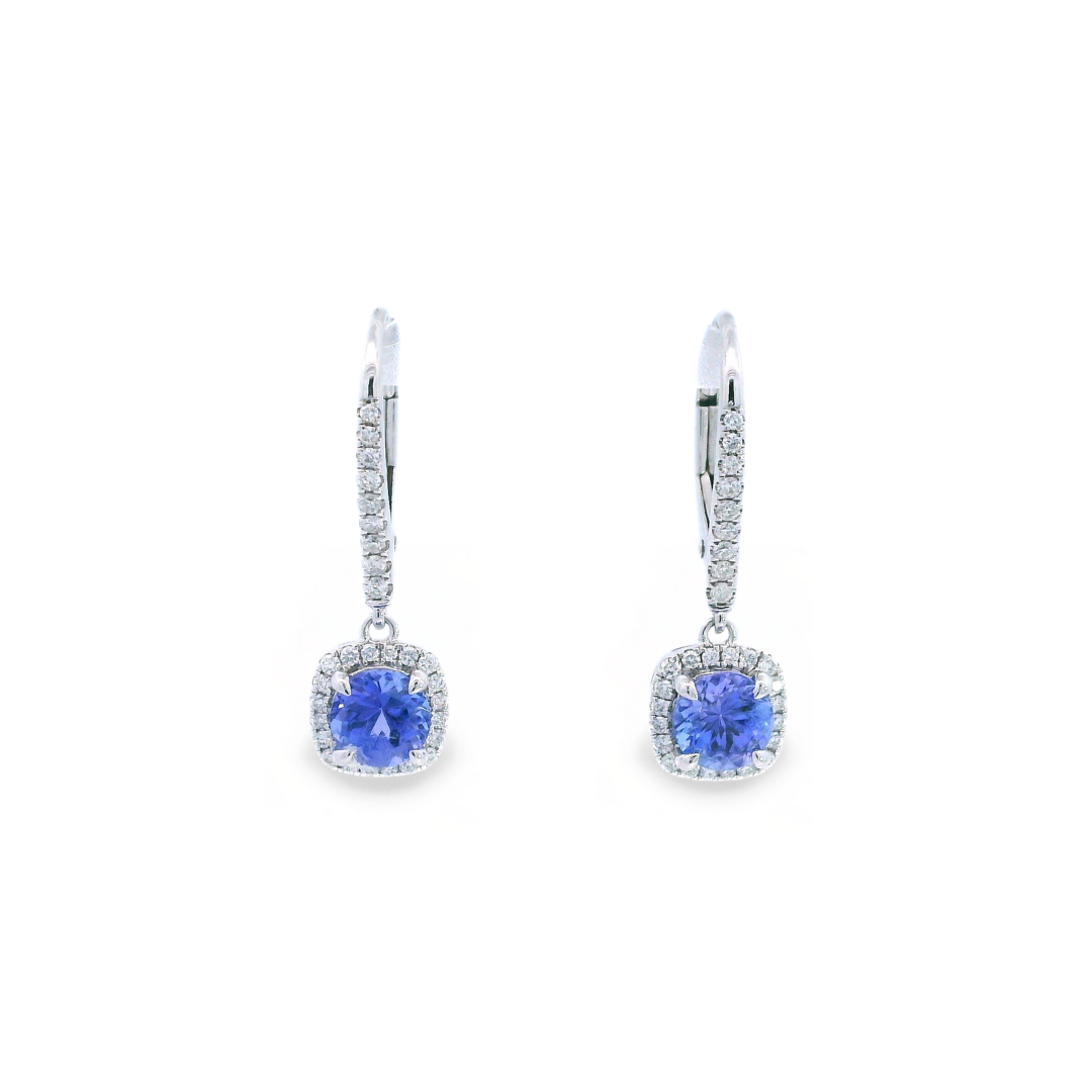 18ct white gold tanzanite and diamond cluster earrings featuring round-cut tanzanites with cushion-shaped diamond halos and articulated drops.