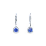 18ct white gold tanzanite and diamond cluster earrings featuring round-cut tanzanites with cushion-shaped diamond halos and articulated drops.