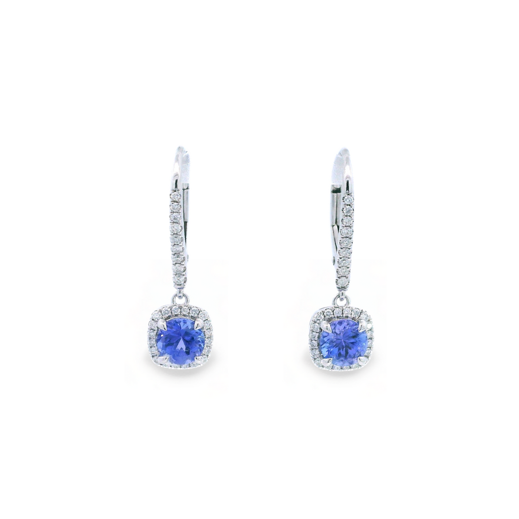 18ct white gold tanzanite and diamond cluster earrings featuring round-cut tanzanites with cushion-shaped diamond halos and articulated drops.
