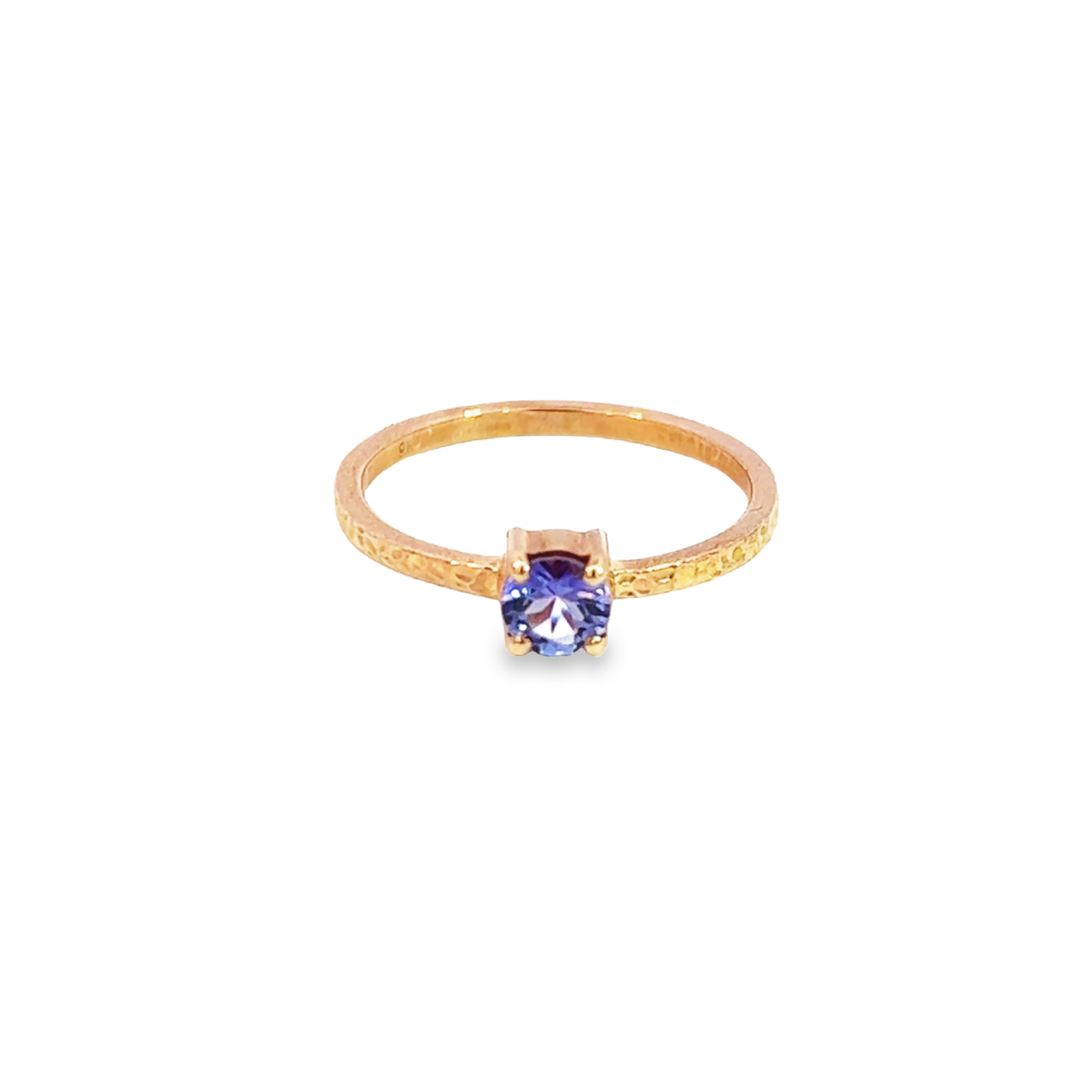 9ct rose gold ring featuring a 5mm round brilliant cut tanzanite in a four-claw setting with a square-profile beaten finish band.