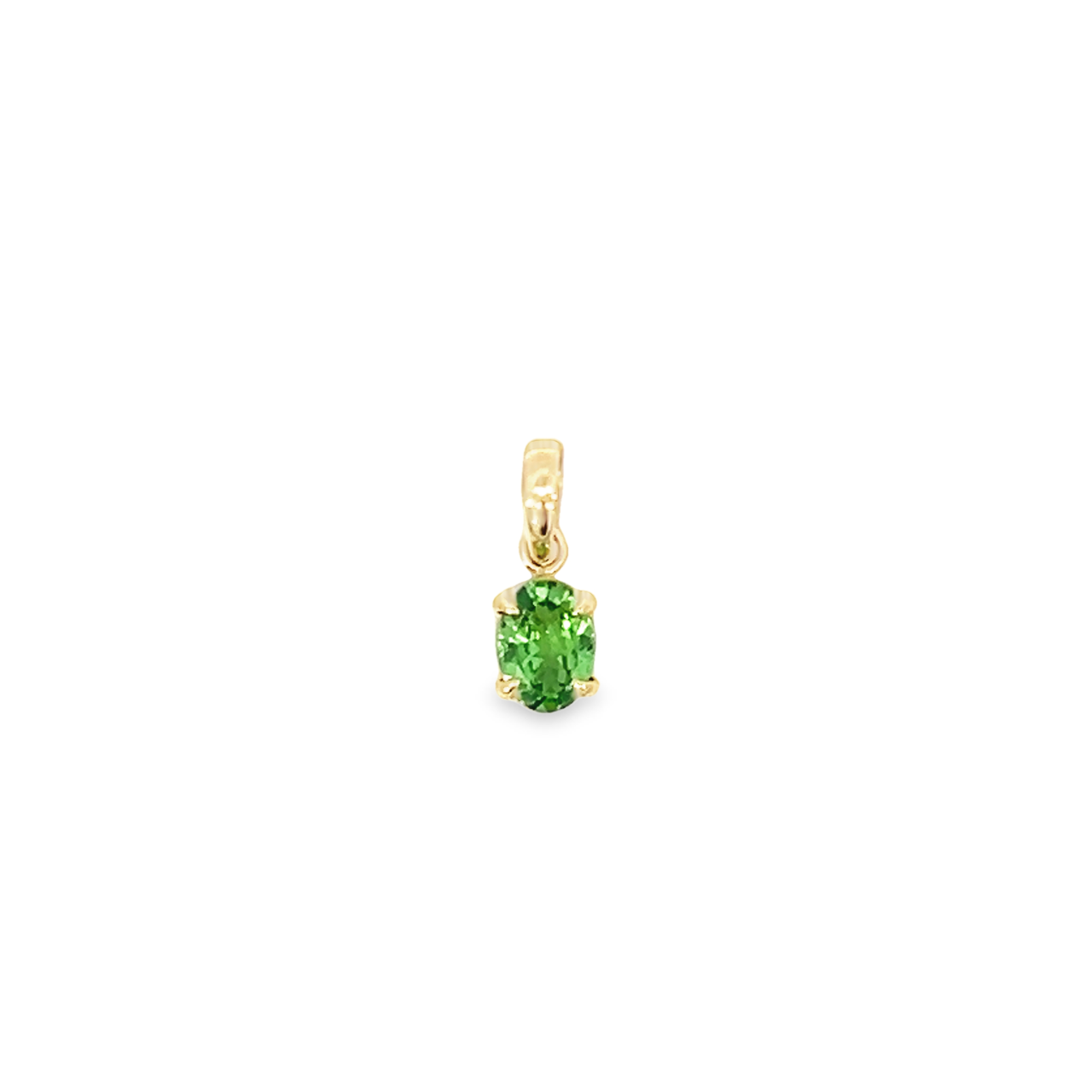 18ct yellow gold pendant featuring a 7x5mm oval-cut tsavorite in a four-claw setting with post and bearing collet, suspended from an articulated pendant runner.