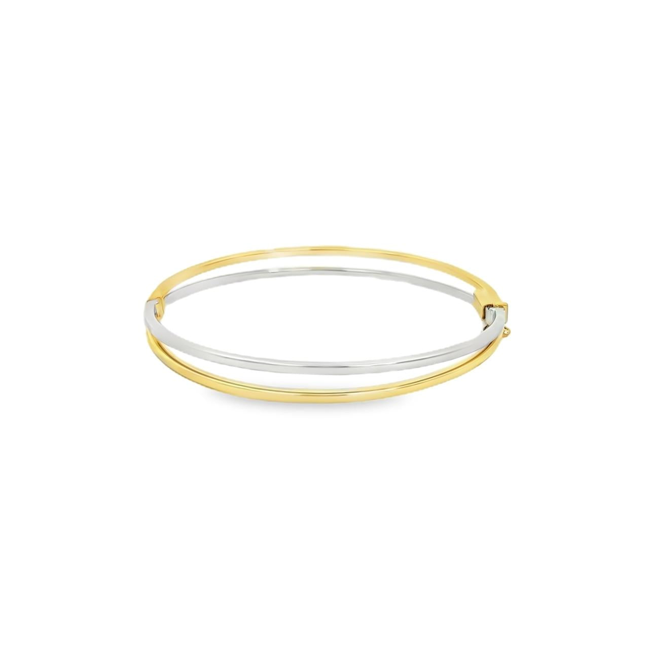9ct yellow and white gold two tone hinged oval bangle featuring a split design, 60 x 54mm inside dimensions.