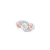 18ct white and rose gold ring featuring a round white diamond centre, two Argyle pink diamond side stones, and bead-set diamond shoulders in a loop design.