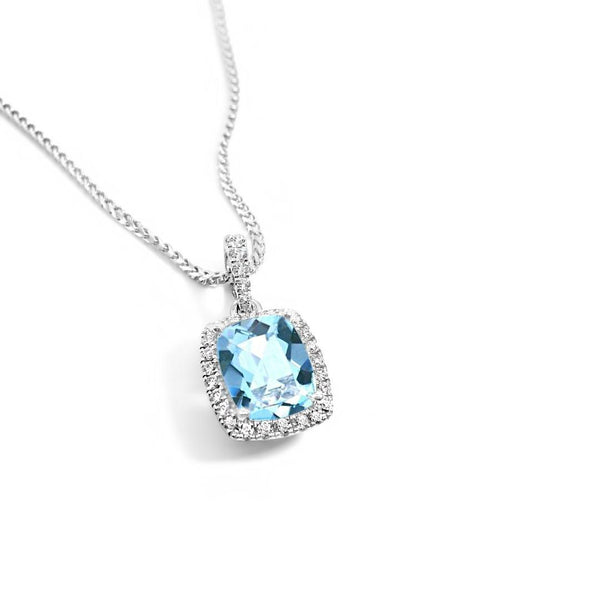 18ct white gold cushion cut aquamarine pendant with diamond halo.