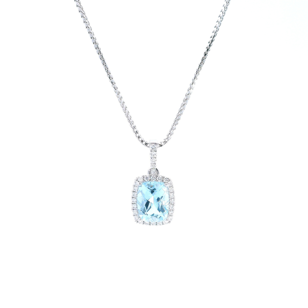 18ct white gold cushion cut aquamarine pendant with diamond halo.
