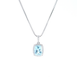 18ct white gold cushion cut aquamarine pendant with diamond halo.