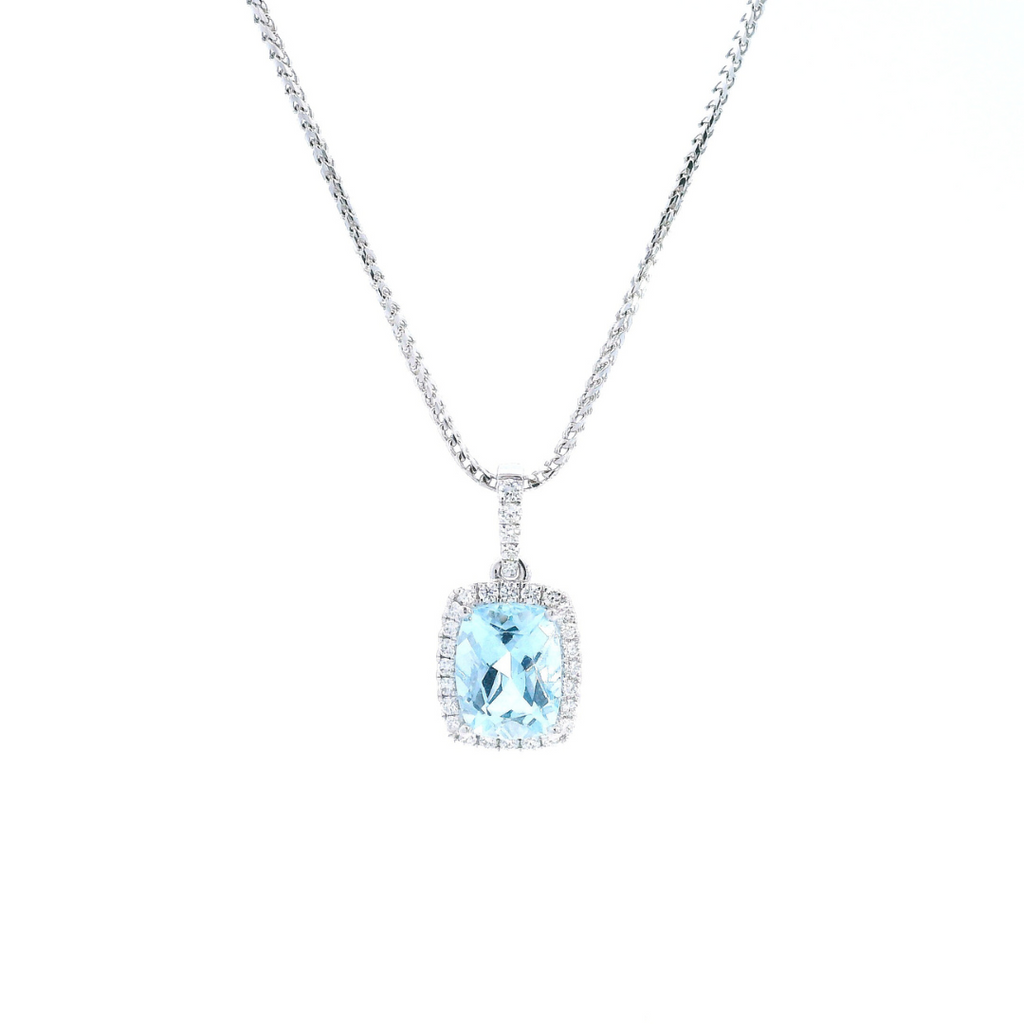 18ct white gold cushion cut aquamarine pendant with diamond halo.