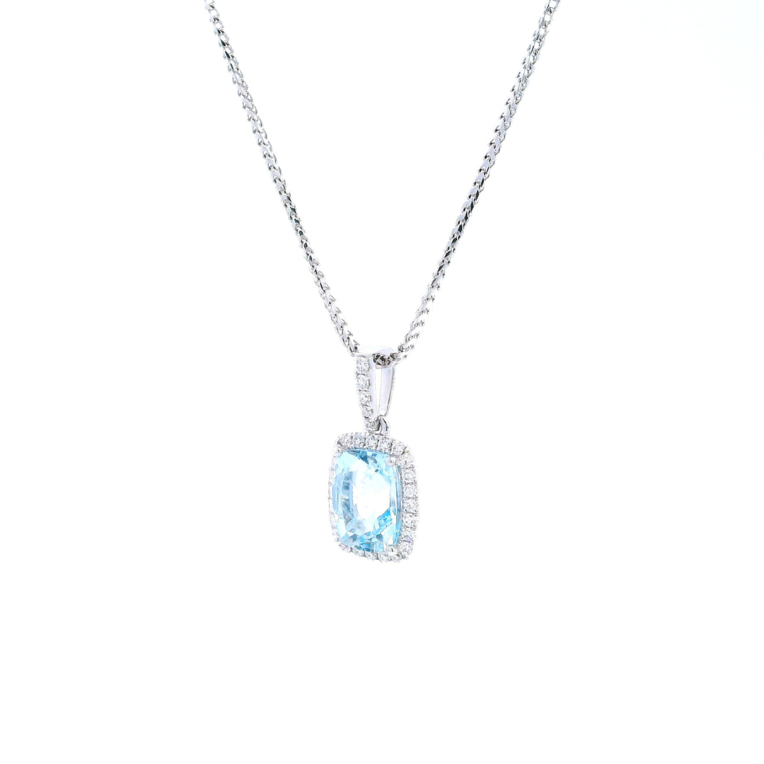 18ct white gold cushion cut aquamarine pendant with diamond halo.