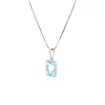 18ct white gold cushion cut aquamarine pendant with diamond halo.