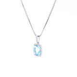 18ct white gold cushion cut aquamarine pendant with diamond halo.
