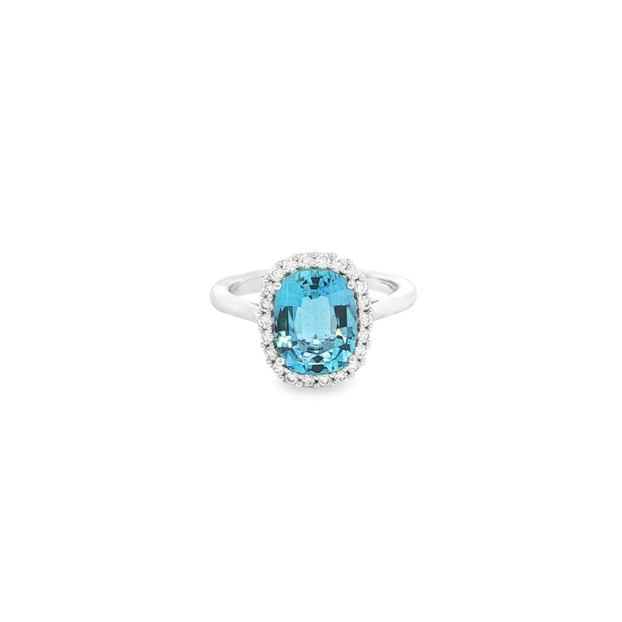 18ct white gold cushion-cut aquamarine ring with diamond halo.