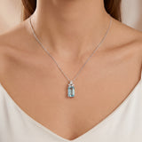 18ct white gold aquamarine pendant with fan-style pear and marquise diamond setting.