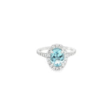 18ct white gold aquamarine and diamond halo ring with oval aquamarine and split diamond shoulders.