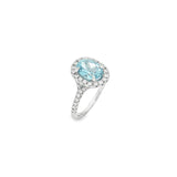 18ct white gold aquamarine and diamond halo ring with oval aquamarine and split diamond shoulders.