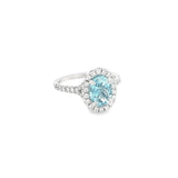 18ct white gold aquamarine and diamond halo ring with oval aquamarine and split diamond shoulders.