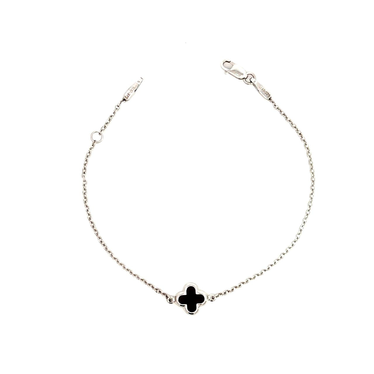 9ct white gold trace link bracelet with small black clover centre.