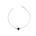 9ct white gold trace link bracelet with small black clover centre.