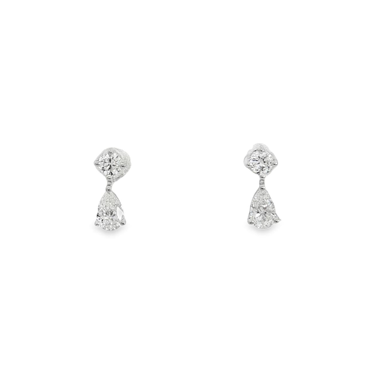 18ct white gold diamond double drop earrings with round and pear cut diamonds.