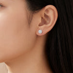 18ct white gold diamond halo stud earrings with round brilliant cut diamonds.