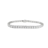 18ct white gold diamond tennis bracelet with round brilliant cut diamonds in four-claw settings.