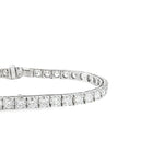 18ct white gold diamond tennis bracelet with round brilliant cut diamonds in four-claw settings.
