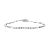 18ct white gold diamond tennis bracelet with round brilliant cut diamonds in four-claw settings.