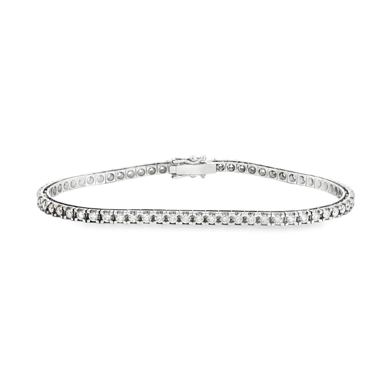 18ct white gold diamond tennis bracelet with round brilliant cut diamonds in four-claw settings.